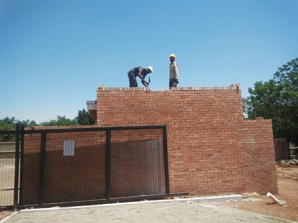 NK Construction team on site overlooking a new retail development